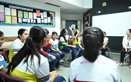 students having group discussions at the editorial board of the MRIS, sec 21c,Faridabad
